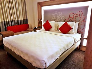 Noble Resort Hotel Melaka in Melaka, image may contain: Furniture, Bedroom, Bed, Indoors