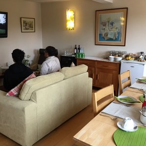 Living/dining area with flat-screen TV