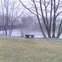Small park with view of bridge.