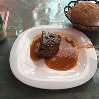 Baked beef with tomato sauce