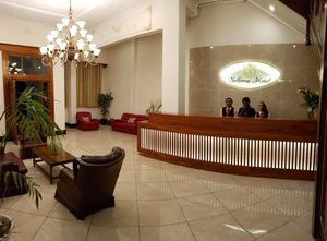 Selborne Hotel in Bulawayo, image may contain: Reception, Foyer, Chandelier, Person