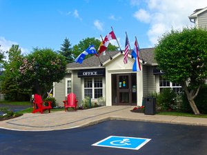 Amsterdam Inn & Suites Sussex in Sussex, image may contain: Neighborhood, City, Street, Chair