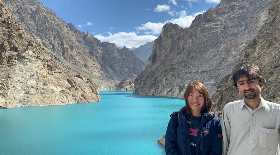Our Guest from Singapore with Manzoor Hunzai (MO HTT) at Attabad Lake-Upper Hunza Valley enjoying their Trip. Book your Trip with us now