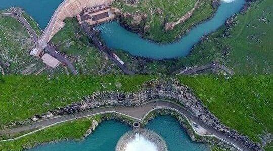 Lake, dam and outlet water channels from top. 