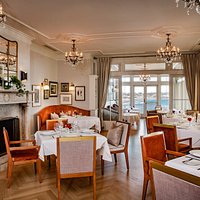 Cara's dining room boasts sweeping ocean views of Easton's Beach.