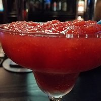 A damn good strawberry daiquiri who is overflown with rum 😂