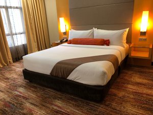 The Waterfront Hotel in Kuching, image may contain: Furniture, Bed, Home Decor
