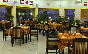 MPT Wind N Waves Cottages, Bhopal in Bhopal, image may contain: Restaurant, Dining Table, Table, Cafeteria