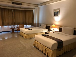 Siamgrand Hotel in Udon Thani, image may contain: Hotel, Resort, Bed, Furniture