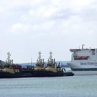 The Irish Ferry following the departing sea lane with the tugs berth in the foreground..