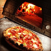 Pepperoni pizzas with chillis