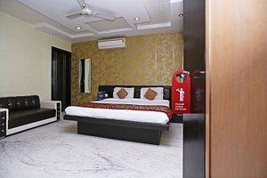 MD 9 Star Hotel in Agra, image may contain: Couch, Furniture, Bed, Bedroom