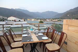 Hotel Indira Nikunj in Rishikesh, image may contain: Dining Table, Table, Resort, Hotel