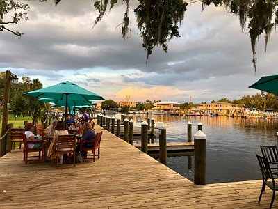 Loved the college and pro football flags hanging from the ceiling - Picture  of Old Mill Tavern, Homosassa - Tripadvisor