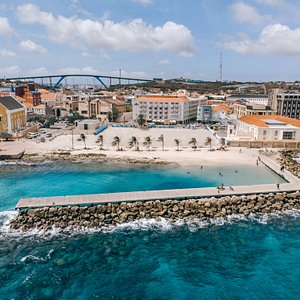 Aerial view of our stunning hotel and private beach! Located in the heart of all action.. Right here in Willemstad, Curaçao!