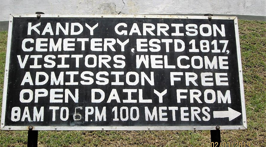 Directional signboard 100 meters before the entrance