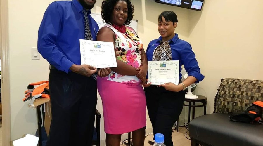 Reggie and Que HIE DreamTeam with AGM Trena presenting the awards for most memorable name mentions in a review