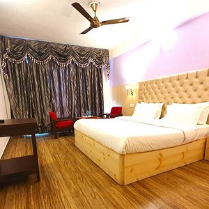 Super Deluxe Valley View Room with Balcony are well lit comfortable rooms with a charming color scheme and all modern amenitie