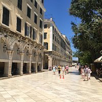 Looking down the paved driveway to the Palace of Saints Michael and George and the statue of Lord Frederick Adam.