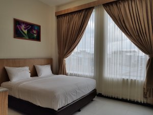 Bintan Lumba Lumba Inn in Bintan Island, image may contain: Home Decor, Bed, Furniture, Painting