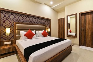 Hotel Spiti in Mathura, image may contain: Interior Design, Corner, Lamp, Bed