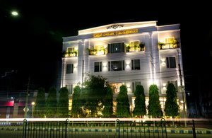 Hotel Asansol International in Asansol, image may contain: Hotel, Lighting, Night, Office Building