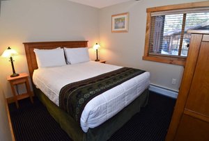 Timber Inn Motel in Ludlow, image may contain: Furniture, Bed, Bedroom, Indoors