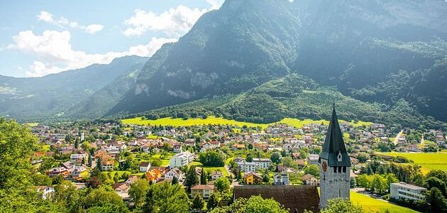 #liechtenstein is a 25km long #principality between #austria and #switzerland . It is known for its #medieval #castles #alpine #landscapes and #villages linked by a network of #trails . The capital #vaduz , a #cultural and #financial center, is home to #kunstmuseumliechtenstein , with #galleries of #modern and #contemporary #art