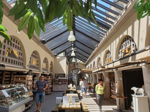 Fruit Stall With People Buying At Morlaix Weekly Market France