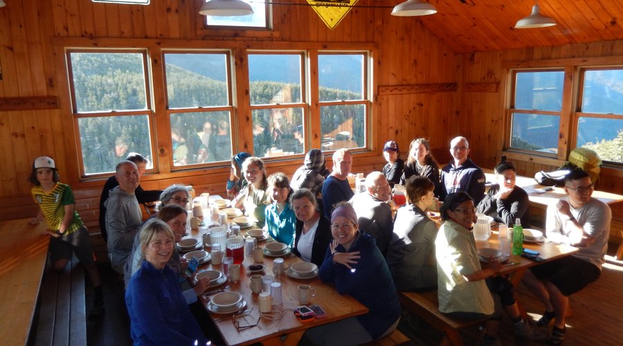 Dining hall. Dinners and breakfasts served family style. You will never dine with such a fine view of the Franconia Ridge!