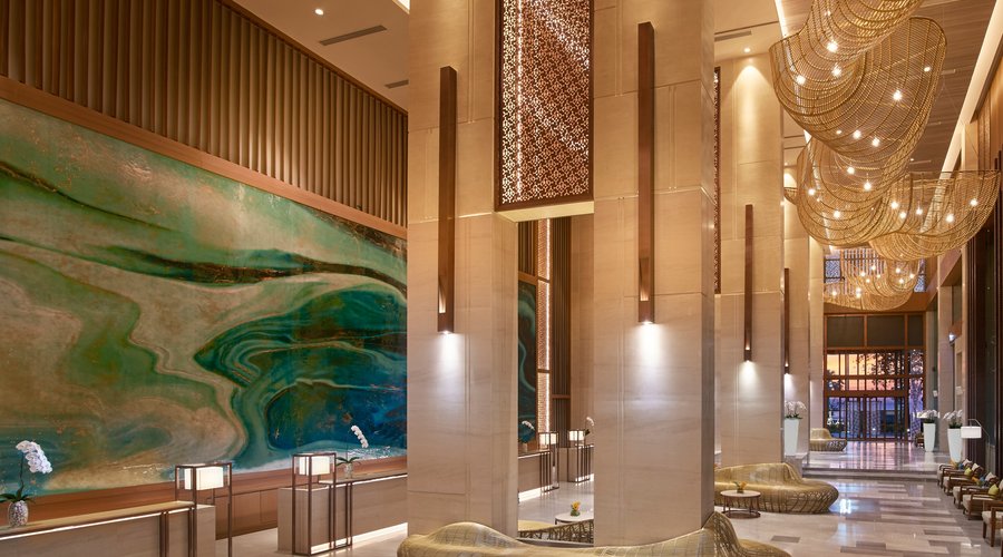 Contemporary turquoise lobby at Amari Tower.