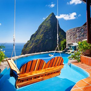 The Luxurious Hilltop Dream Suite features a Ladera Romantic Swing for two with private en-suite Pool and and an  "Open Air " Design without a 4th wall,  offering unobstructed panoramas of the Majestic Pitons, Caribbean Sea and the lush, tropical rainforest. 
