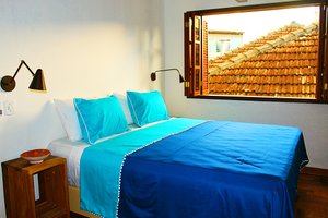 Green 53 Boutique Hotel in Ilheus, image may contain: Furniture, Bed, Bedroom, Room