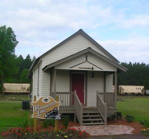 Front of Roadmasters Lodge next to the railroad tracks. Notice the train in the background.