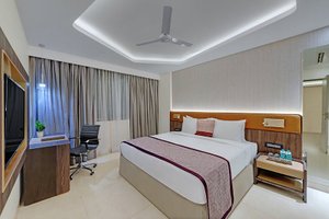 The Fern Residency, Karad in Karad, image may contain: Screen, Monitor, Ceiling Fan, Interior Design