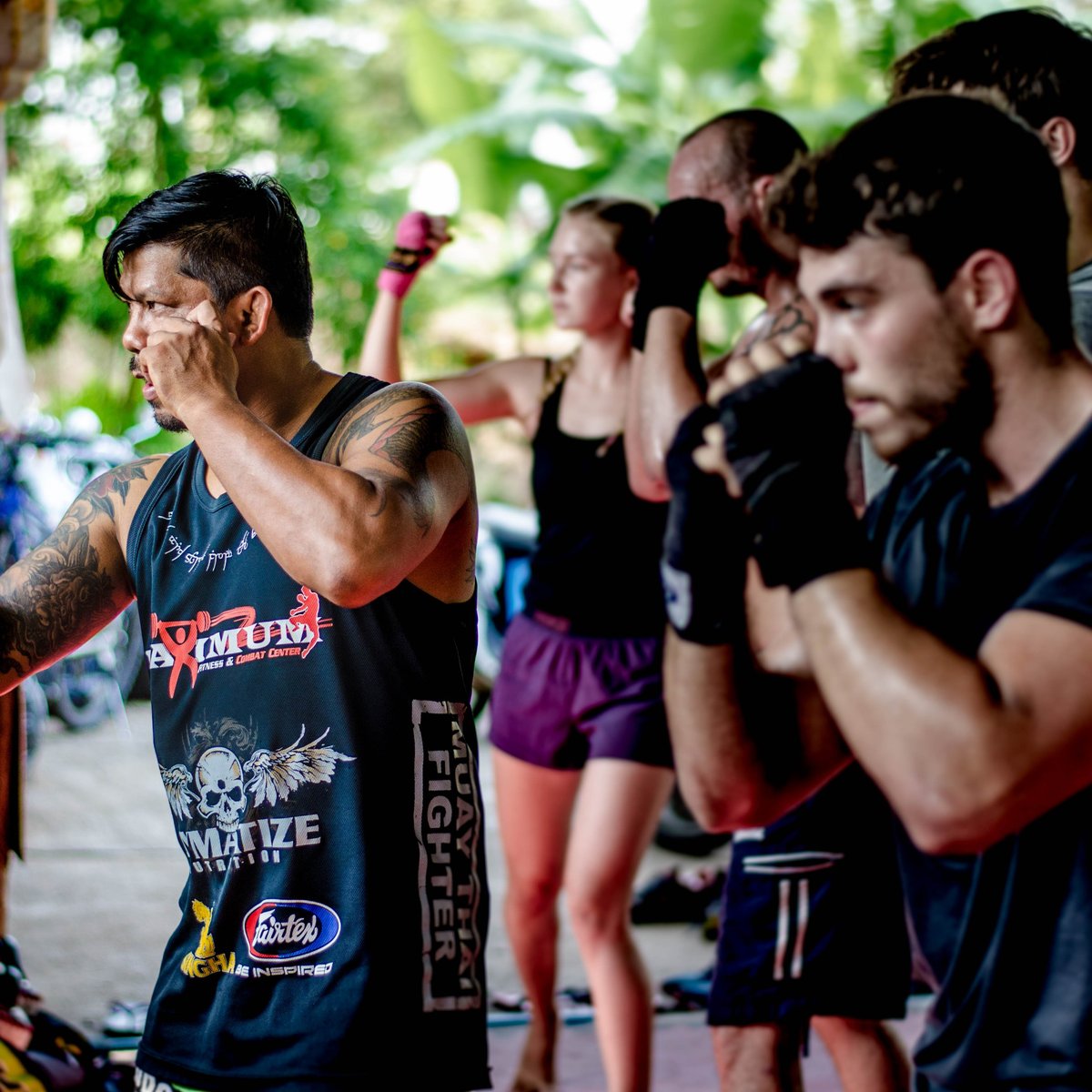 Tourists swap Thailand's beaches for cage fights