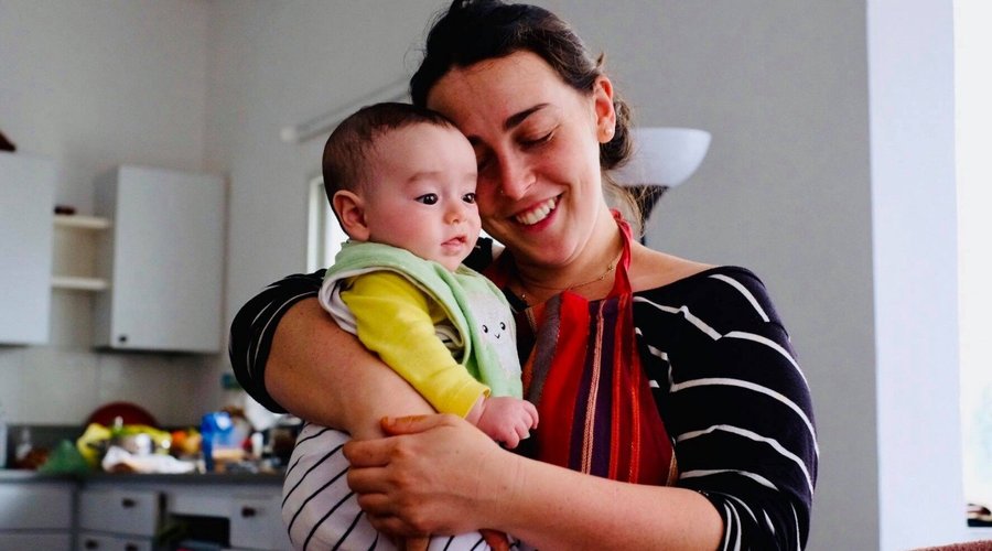Host Aliya with her baby after a class