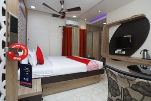 OYO 2038 Hotel Green Leaf Regency in Kolkata (Calcutta), image may contain: Ceiling Fan, Screen, Furniture, Monitor