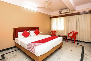 Hotel Chandra Palace in Mysuru (Mysore), image may contain: Chair, Furniture, Bed, Corner