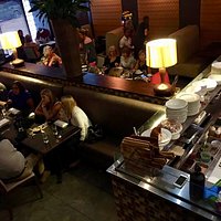 This is a view of the first floor from the stairs to the second floor. The second floor includes outdoor seating as well as a “meeting” room. The second floor is more open and brighter.