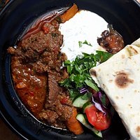 Our deep and deliscious beef curry! Hand made organic roti and backyard apple chutney.