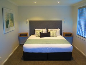 Beechwood Boutique Accommodation in Dunedin, image may contain: Furniture, Bed, Bedroom, Home Decor