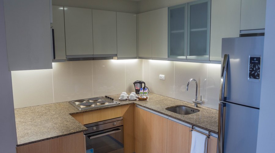 Family Suite full functioning kitchen with full sized fridge,microwave, oven and electric kettle. 