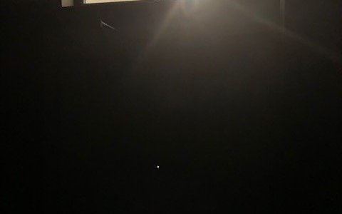 Blinding outside light above doorway window with room lights off and no way to cover it to darken room