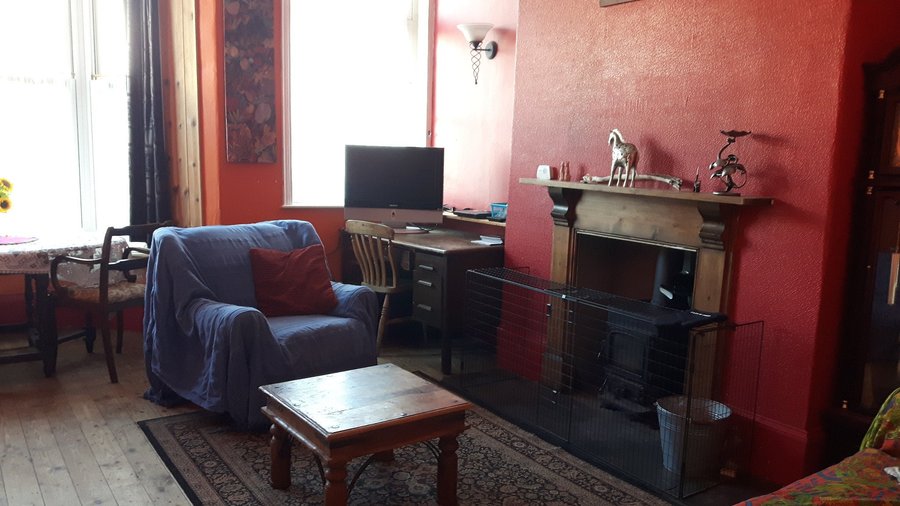 The bunkhouse living room - communal space for all guests. This is a spacious and airy room, with a big bay window. There's a woodburner for those chilly evenings and a TV and DVD player (with a good selection of DVDs for guests' enjoyment). There is no broadcast television at the property - hence the DVD library! There is free wifi available for guests' use. 