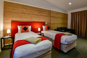 Crossroads Ecomotel in Port Augusta, image may contain: Bed, Furniture, Hotel, Interior Design