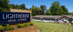Lighthouse Motel & Cottages in Conquerall Bank, image may contain: Hotel, Grass, Vegetation, Motel
