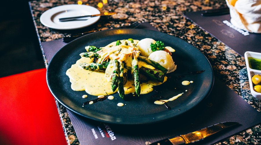 Pork fillet with crab meat, asparagus served with hollandaise sauce