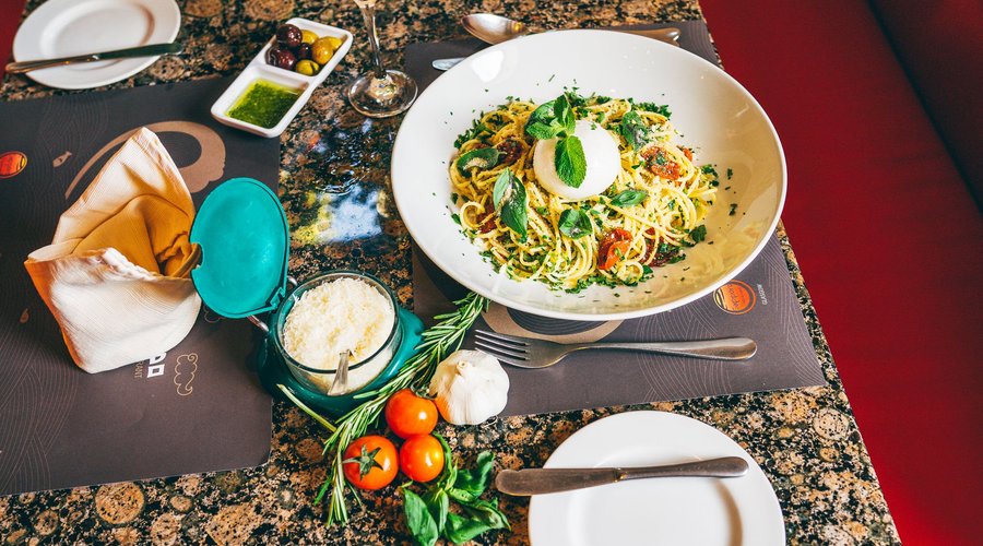 Pasta crumbs rustica. Spaghetti, crumbs, sundried tomatoes, garlic, basil leaves and burrata mozzarella on top.