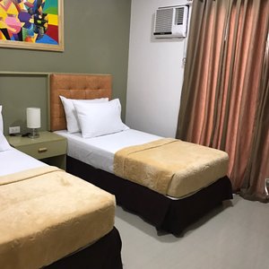 ETT HomeTel in Panay Island, image may contain: Furniture, Bed, Lamp